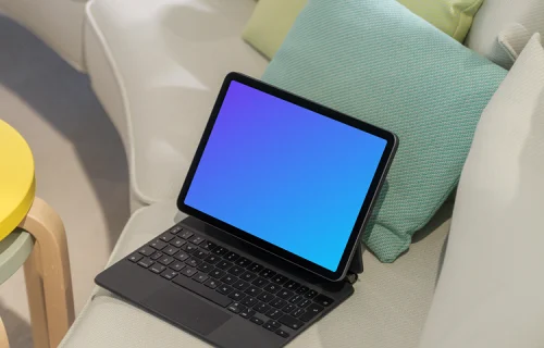 iPad Air mockup on a cozy couch with colorful cushions