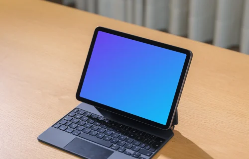 iPad Air mockup on wooden desk with keyboard
