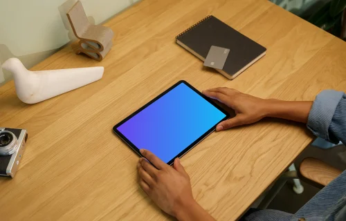 iPad Air mockup on wooden table with decorations