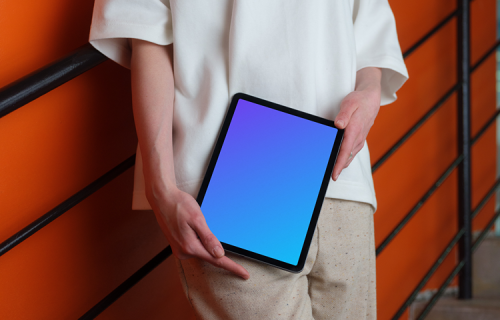 iPad Air Mockup with Woman Against Orange Wall