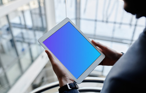 iPad Mini mockup held by male user