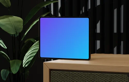 iPad Pro 12.9-inch mockup on a wooden stand with plants