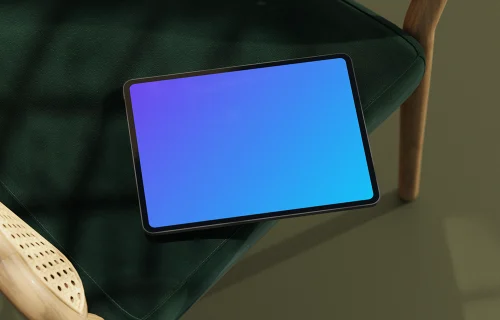 iPad Pro mockup on a green cushioned chair