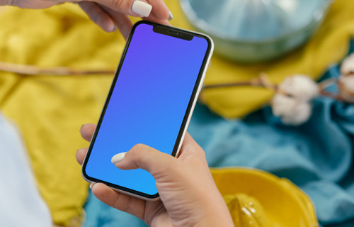 iPhone 12 Pro mockup held by user