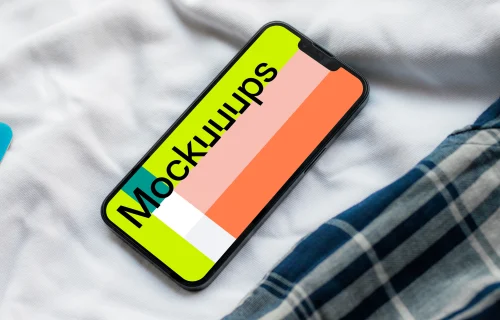 iPhone 13 mockup on bed