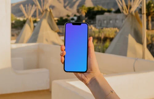 iPhone 13 Pro mockup held by a user outdoors in the sun