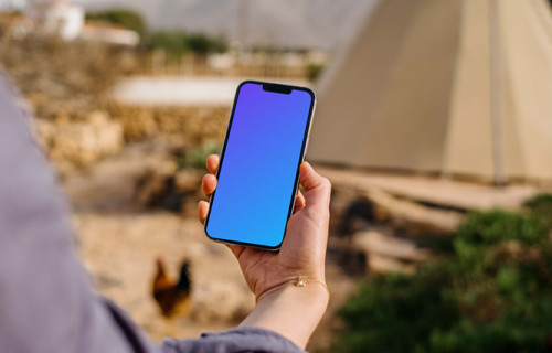 iPhone 13 Pro mockup held by a user