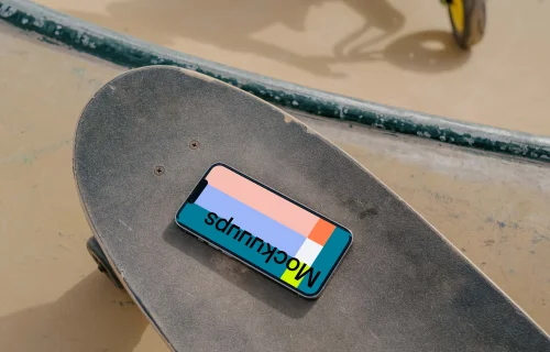  iPhone 13 Pro mockup on a skateboard
