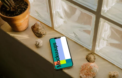 iPhone 13 Pro mockup on a window ledge