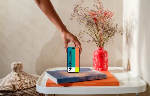 iPhone 15 Pro mockup in a woman's hand on a modern home setting