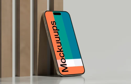 iPhone 16 mockup standing on reflective surface with geometric backdrop