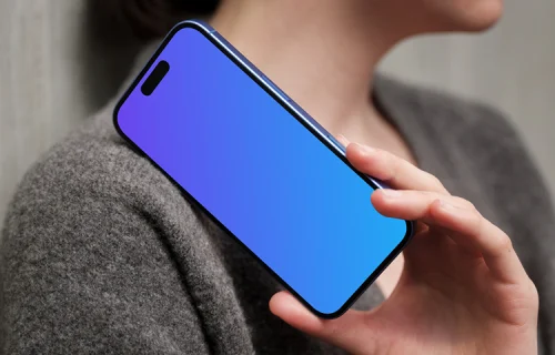 iPhone 16 mockup with hand and concrete wall