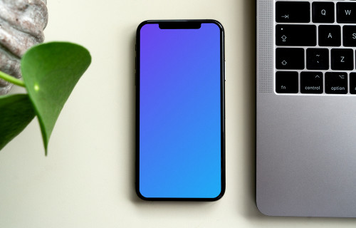 iPhone mockup beside a MacBook