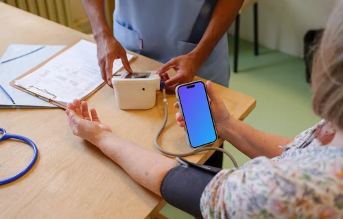 iPhone mockup in the patient’s hand