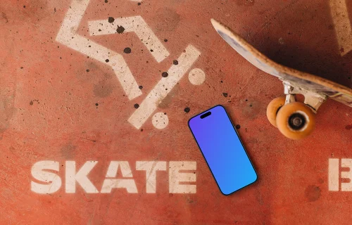 iPhone mockup next to the skateboard