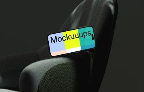 iPhone mockup on a modern fabric chair