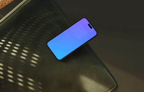 iPhone mockup on a modern leather surface