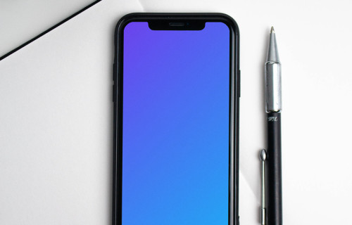 iPhone mockup on a white notebook
