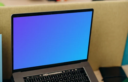 MacBook Air mockup and calculator in use by a man