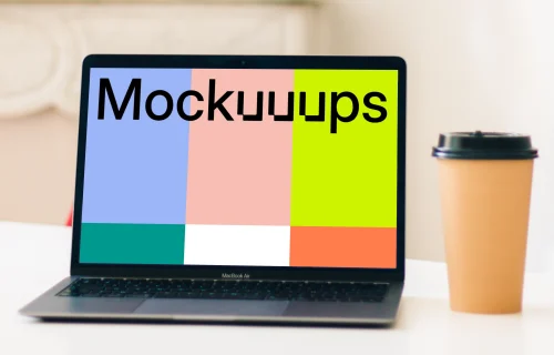 MacBook Air mockup beside a cup of coffee