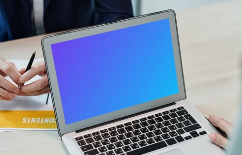MacBook Air mockup on a wooden table