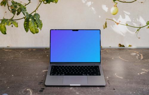 MacBook Pro mockup under a climbing plant
