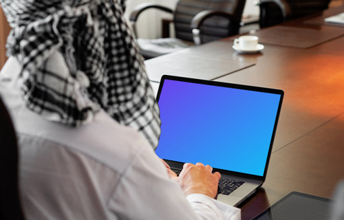 MacBook Air mockup used by a lady with a head covering