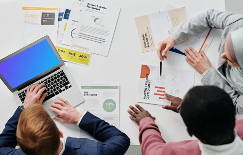 MacBook Air mockup with people at business meeting