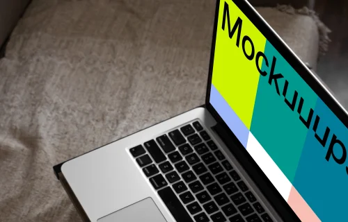 MacBook mockup on bed