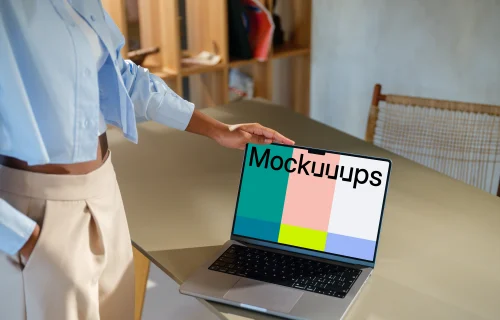 MacBook Pro 14 inch mockup with female hand on a modern desk