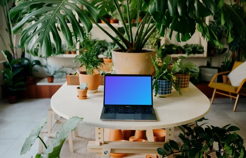 MacBook Pro mockup amidst an indoor garden