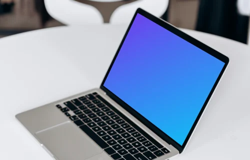 MacBook Pro mockup beside a phone and notepad
