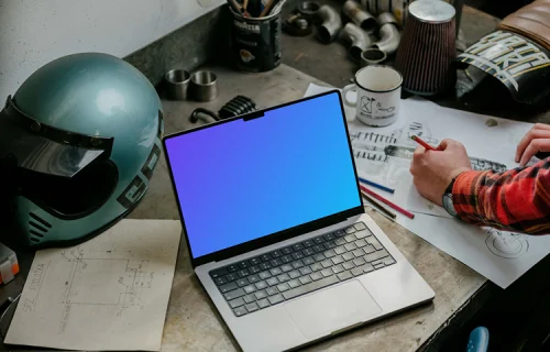 MacBook Pro mockup beside machine drawing