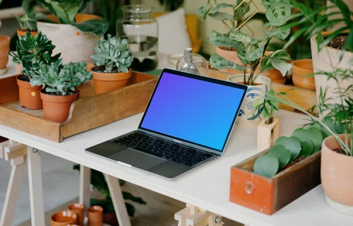 MacBook Pro Mockup between potted plants