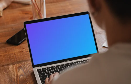 MacBook Pro mockup in a meeting room