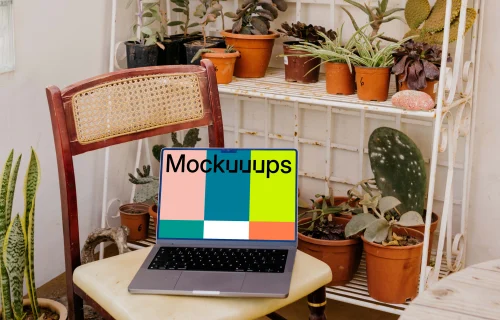 MacBook Pro mockup in front of many potted plants