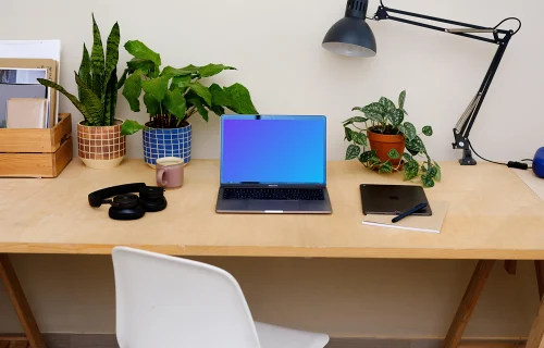  MacBook Pro mockup on a light brown table.