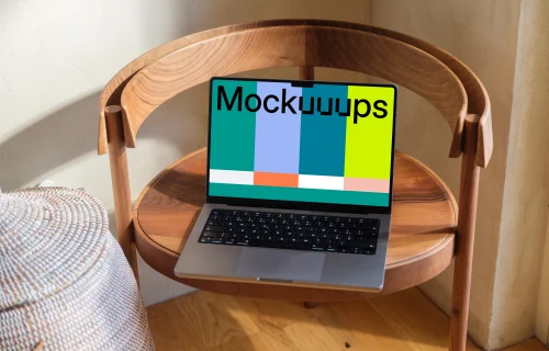 MacBook Pro mockup on a round wooden table