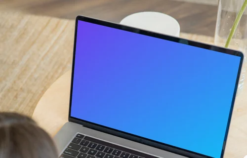 MacBook Pro mockup on a round wooden table