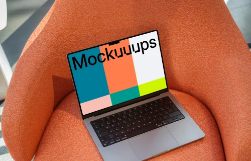 Mockup MacBook Pro sobre un sillón con textura naranja