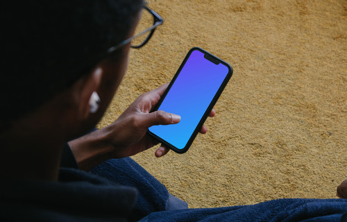 Male hand typing on iPhone mockup
