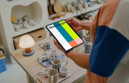 Male hands holding a tablet mockup