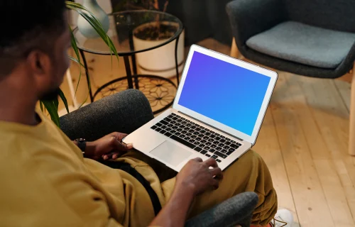 Man using a MacBook Air mockup