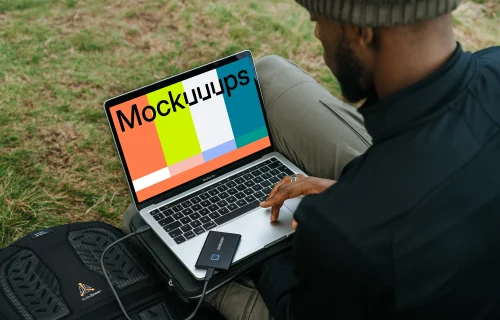 Man woking on MacBook Pro mockup