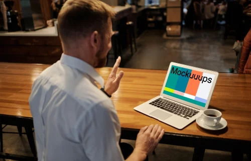 Man working on the MacBook Pro in coworking space