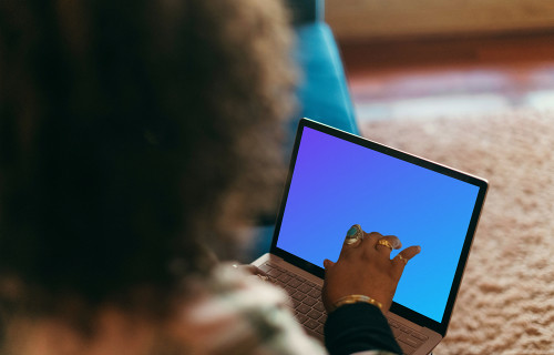Microsoft Surface Laptop mockup on a user’s lap