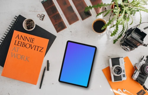 Mockup of tablet device next to the colorful books