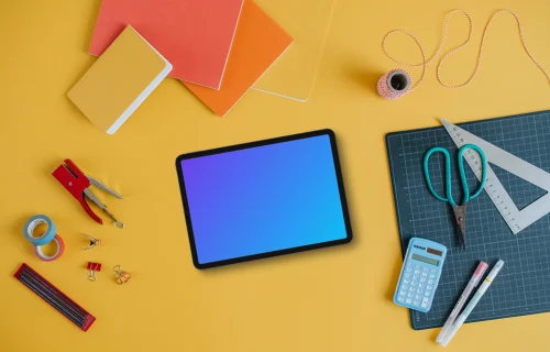 Mockup of tablet placed on the yellow background