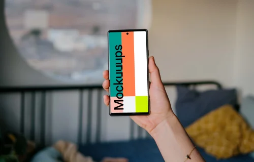 Pixel 6 mockup held by user in a bedroom