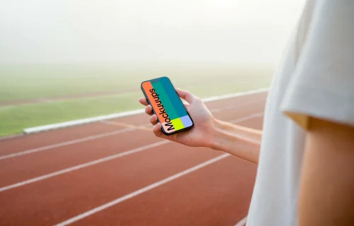 Runner holding an iPhone mockup